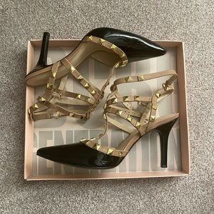 BCBG studded high heels. Black patent leather with taupe straps and gold studs.
